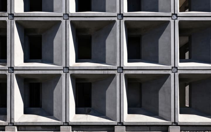 Stacked precast concrete culvert pipes on a civil construction site